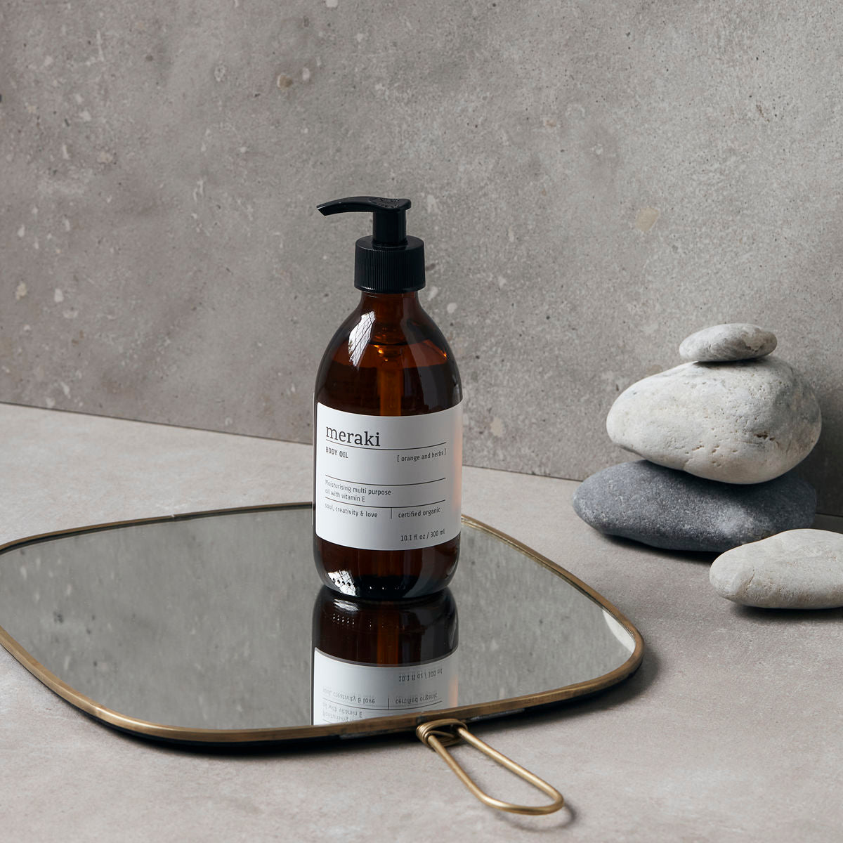 MERAKI ORGANIC BODY OIL ORANGE & HERBS on mirror
