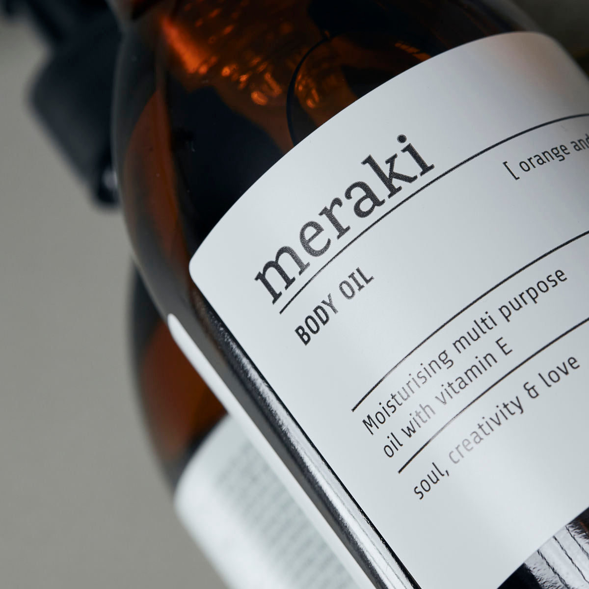 MERAKI ORGANIC BODY OIL ORANGE & HERBS close up of label