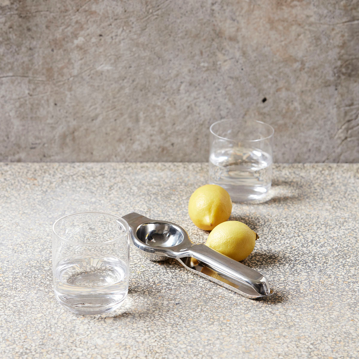 Stainless Steel Lemon Squeezer with lemons