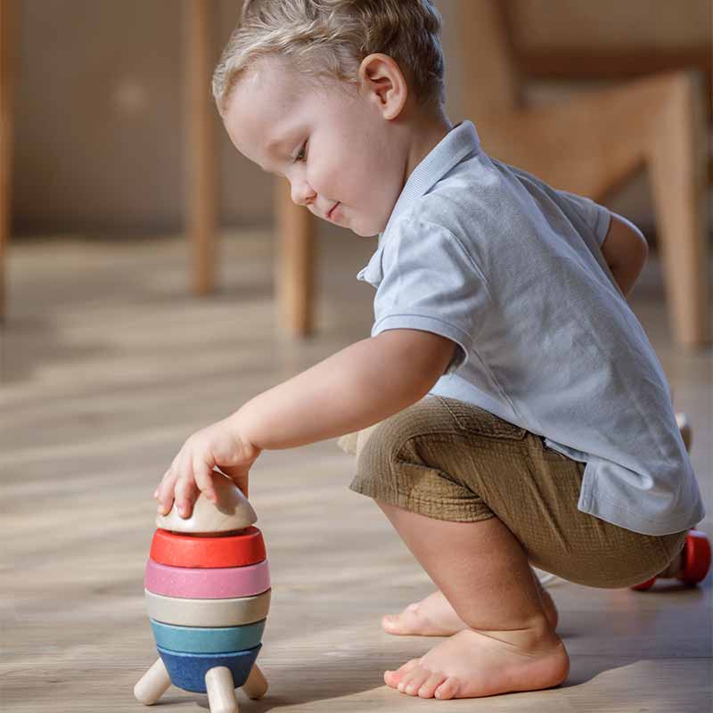 Wooden Stacking Rocket (Orchard Edition) boy from side