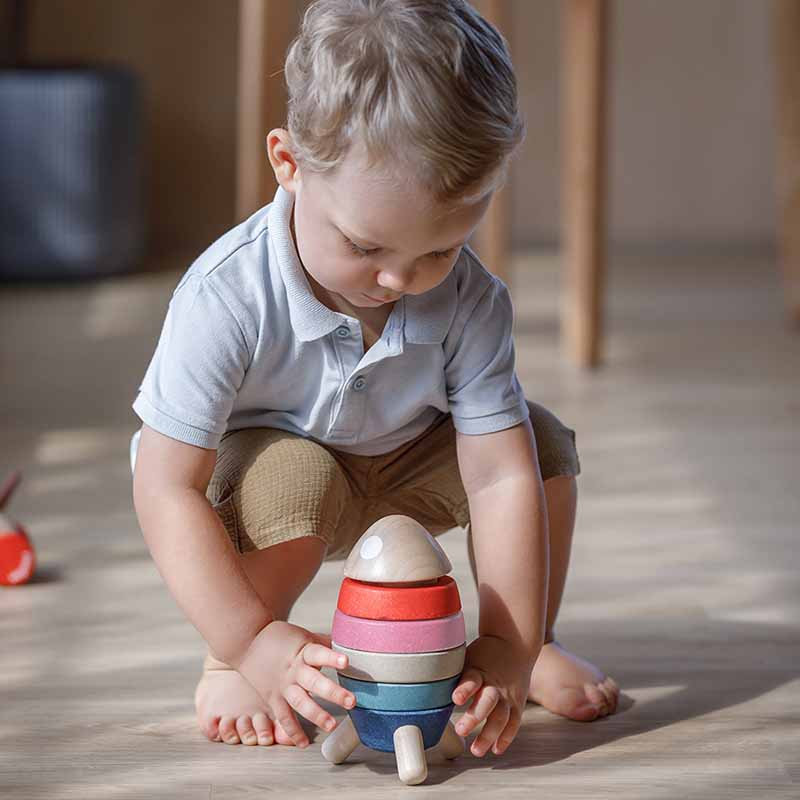 Wooden Stacking Rocket (Orchard Edition) boy playing