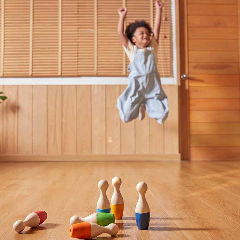 Wooden Toy Bowling Set child jumping